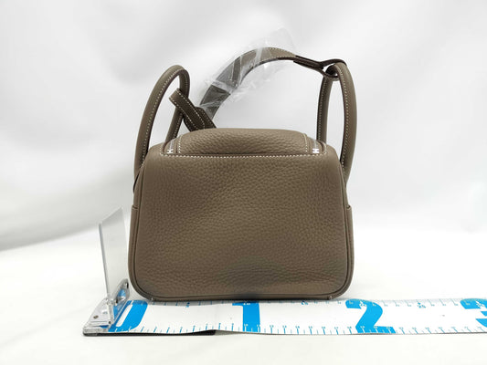 HERMES Lindy Mini Handbag in Taurillon Clemence Etoupe Leather with Silver Hardware and K Stamp