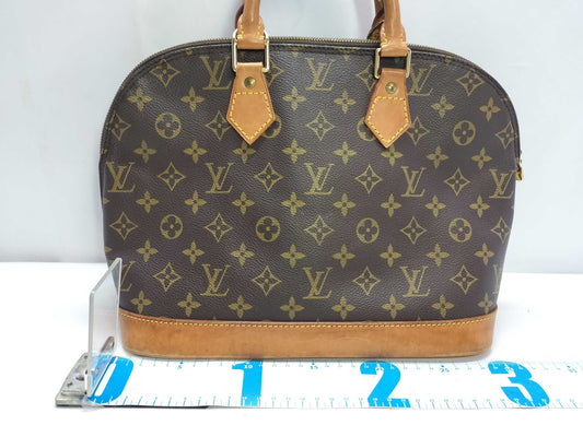 LOUIS VUITTON Monogram Louis Vuitton Monogram Alma Handbag