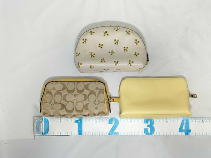 COACH 3-piece pouch set