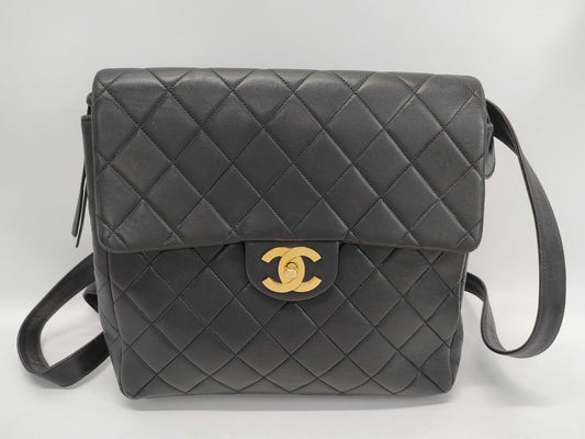 CHANEL Lambskin Black Backpack with Seal