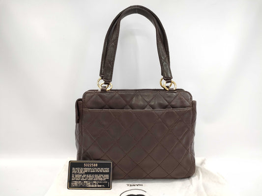 CHANEL Brown Lambskin Matelasse Handbag with Seal and Card