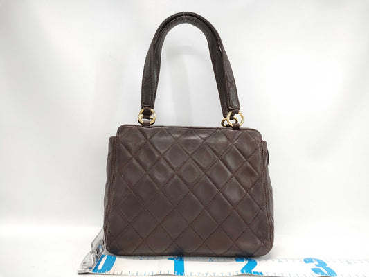 CHANEL Brown Lambskin Matelasse Handbag with Seal and Card