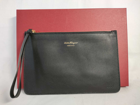 Salvatore Ferragamo black pouch with case