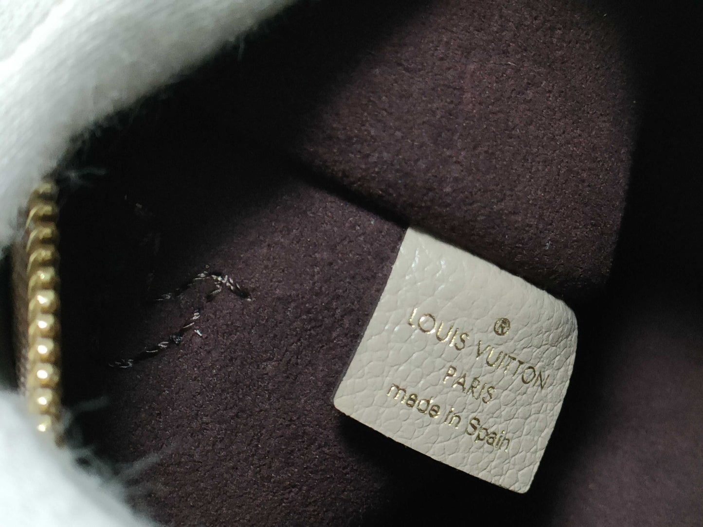 LOUIS VUITTON RFID verification impossible. Serial number verification impossible. Monogram Empreinte Louis Vuitton Neverfull Pouch in Taupe with Gold Hardware.