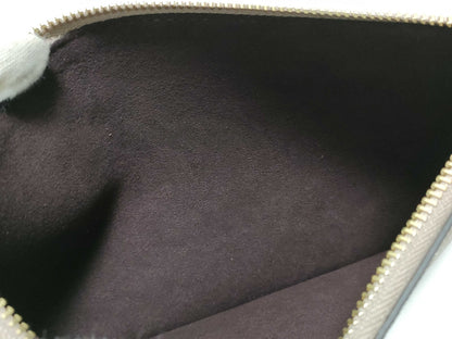 LOUIS VUITTON RFID verification impossible. Serial number verification impossible. Monogram Empreinte Louis Vuitton Neverfull Pouch in Taupe with Gold Hardware.