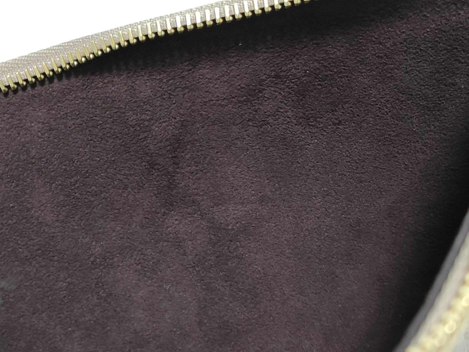 LOUIS VUITTON RFID verification impossible. Serial number verification impossible. Monogram Empreinte Louis Vuitton Neverfull Pouch in Taupe with Gold Hardware.
