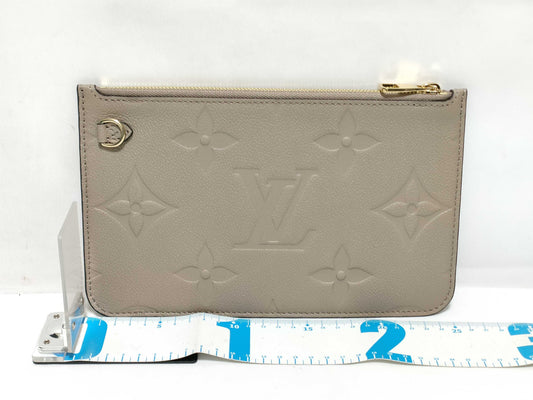 LOUIS VUITTON RFID verification impossible. Serial number verification impossible. Monogram Empreinte Louis Vuitton Neverfull Pouch in Taupe with Gold Hardware.