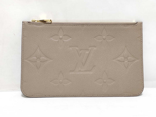 LOUIS VUITTON RFID verification impossible. Serial number verification impossible. Monogram Empreinte Louis Vuitton Neverfull Pouch in Taupe with Gold Hardware.