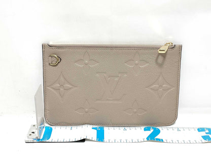 LOUIS VUITTON RFID verification impossible. Serial number verification impossible. Monogram Empreinte Louis Vuitton Neverfull Pouch in Taupe with Gold Hardware.