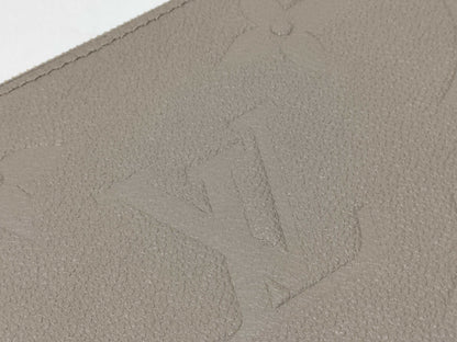 LOUIS VUITTON RFID verification impossible. Serial number verification impossible. Monogram Empreinte Louis Vuitton Neverfull Pouch in Taupe with Gold Hardware.