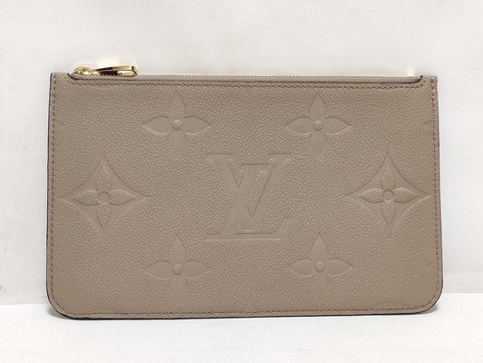 LOUIS VUITTON RFID verification impossible. Serial number verification impossible. Monogram Empreinte Louis Vuitton Neverfull Pouch in Taupe with Gold Hardware.