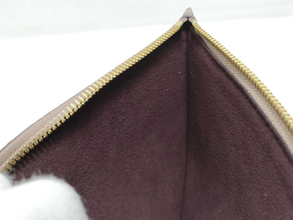LOUIS VUITTON RFID verification impossible. Serial number verification impossible. Monogram Empreinte Louis Vuitton Neverfull Pouch in Taupe with Gold Hardware.