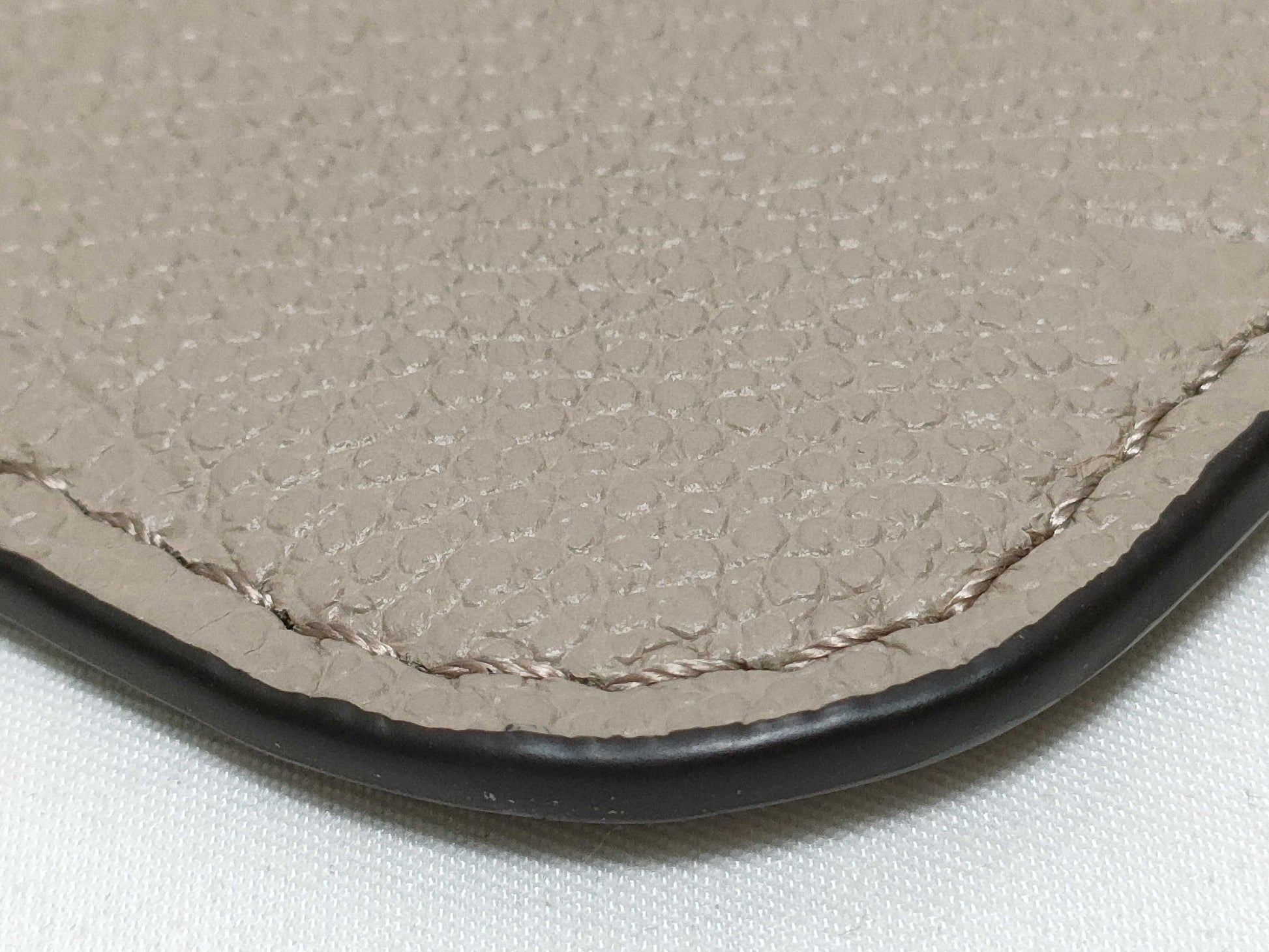 LOUIS VUITTON RFID verification impossible. Serial number verification impossible. Monogram Empreinte Louis Vuitton Neverfull Pouch in Taupe with Gold Hardware.