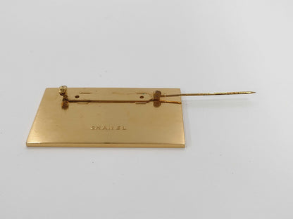 CHANEL logo plate gold brooch