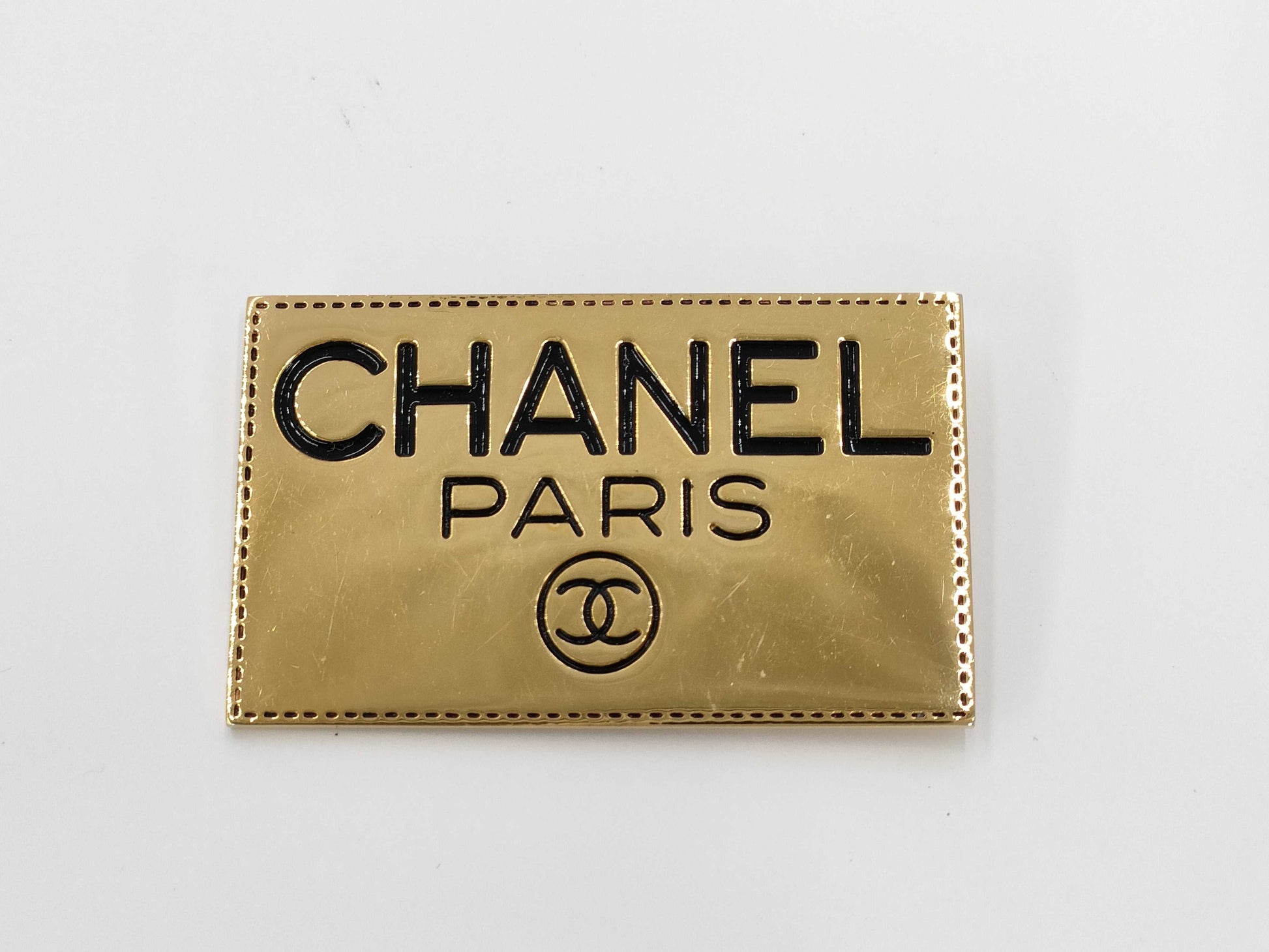 CHANEL logo plate gold brooch