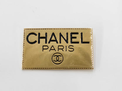 CHANEL logo plate gold brooch