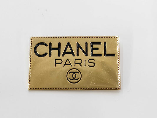 CHANEL logo plate gold brooch