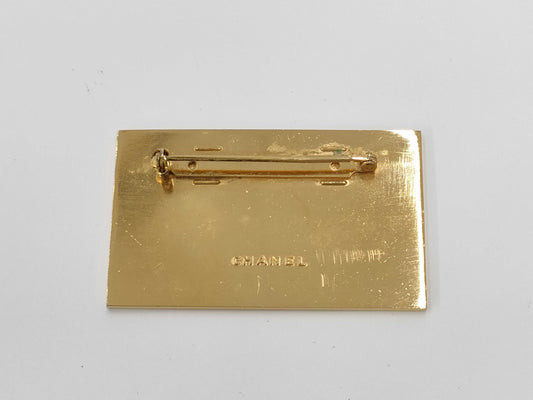 CHANEL logo plate gold brooch