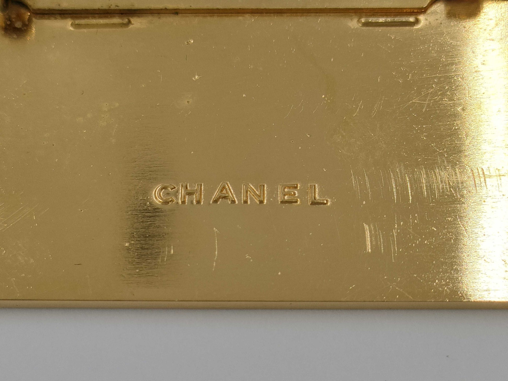 CHANEL logo plate gold brooch