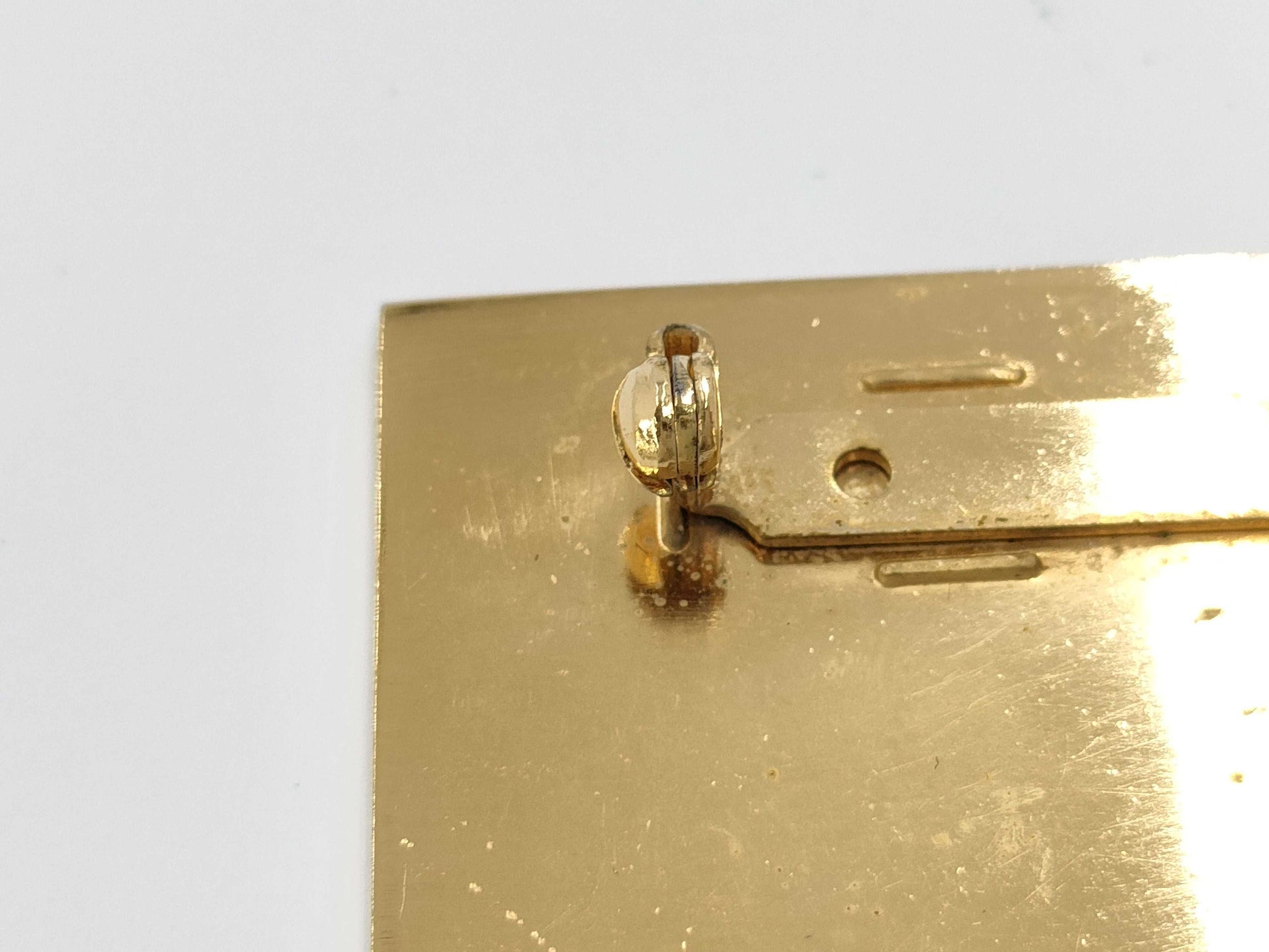 CHANEL logo plate gold brooch