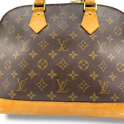 LOUIS VUITTON Alma Monogram Handbag