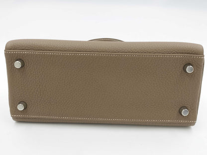 HERMES Kelly 25 Togo Etoupe Handbag, engraved with B, 2023
