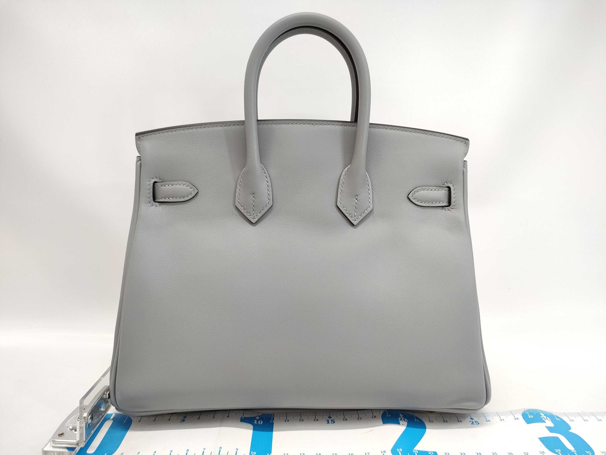 HERMES Birkin 25 in Platinum with Swift Champagne Gold Hardware and K Stamp.