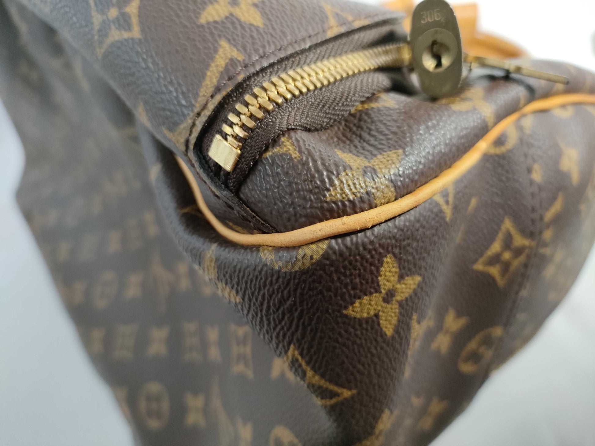 LOUIS VUITTON RFID verification failed. VI1918 Monogram Louis Vuitton Evasion Handbag.