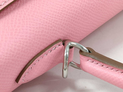 HERMES Kelly 25 handbag with rose confetti exterior, Epson logo, silver hardware, and a double stamp.