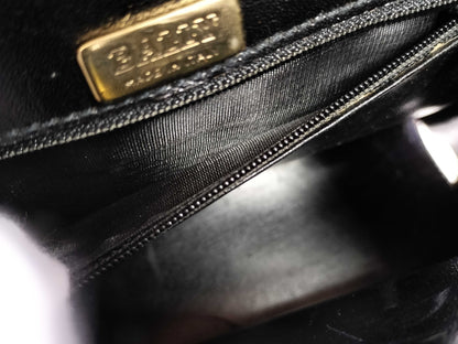 BALLY 2-way Kelly-style shoulder bag with top handle and turnlock. Black leather.