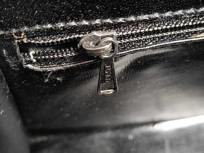 BALLY 2-way Kelly-style shoulder bag with top handle and turnlock. Black leather.