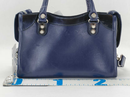BALENCIAGA Giant Mini City Handbag in Dark Navy Leather/Patent Leather Includes dust bag and shoulder strap.