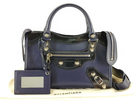 BALENCIAGA Giant Mini City Handbag in Dark Navy Leather/Patent Leather Includes dust bag and shoulder strap.