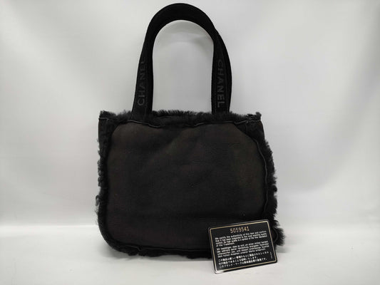 CHANEL Mouton Fur Handbag Black