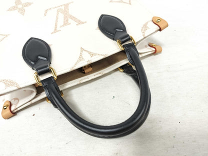 LOUIS VUITTON LV Monogram Dune On the Go PM Handbag, 2-Way, M24533, RFID Enabled, Shoulder Strap and Pouch Included, White/Black