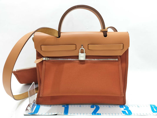 HERMES Airbag Zip Toile Officier Orange Canvas Handbag with A Stamp and Silver Hardware
