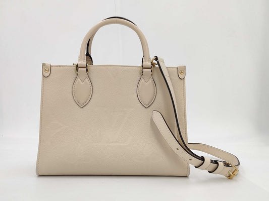 LOUIS VUITTON M46569 Empreinte Giant On the Go PM Crème with Shoulder Strap, RFID Verified Handbag