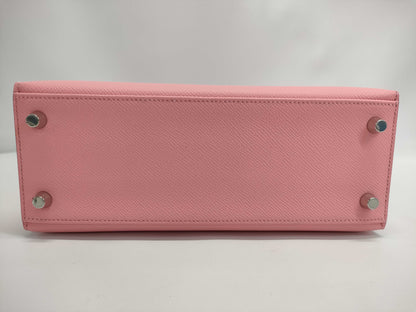 HERMES Kelly 25 handbag with rose confetti on the outside, Epson logo, silver hardware, K stamp.