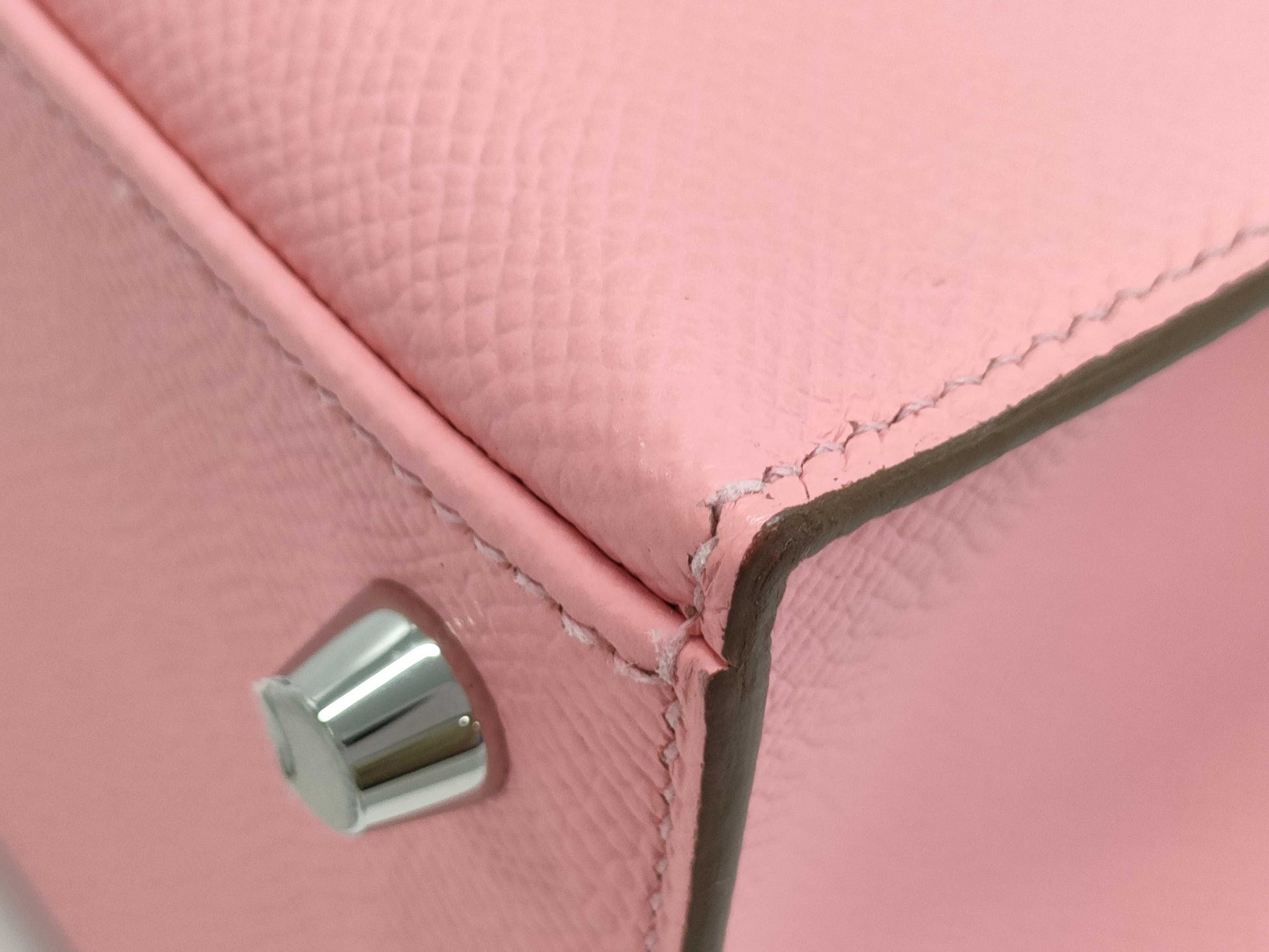 HERMES Kelly 25 handbag with rose confetti on the outside, Epson logo, silver hardware, K stamp.