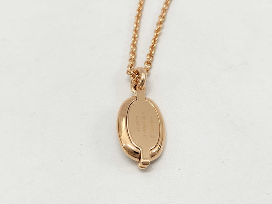 HERMES Mini Maillon pendant in cream with pink gold hardware. Necklace