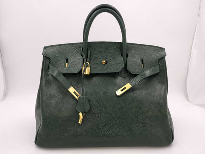 Green handbag with padlock, key and clochette