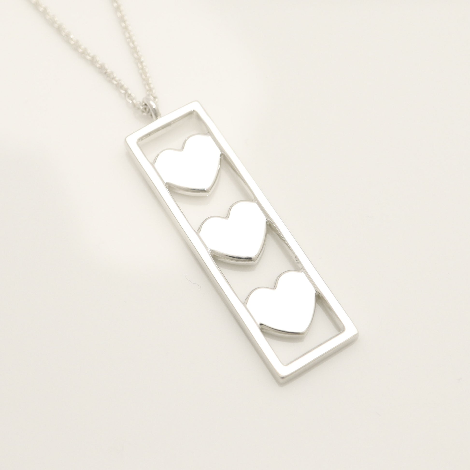 Tiffany & Co. Triple Heart Plate Necklace Pendant in Sterling Silver Weight: 2.58g