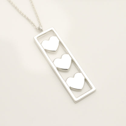 Tiffany & Co. Triple Heart Plate Necklace Pendant in Sterling Silver Weight: 2.58g