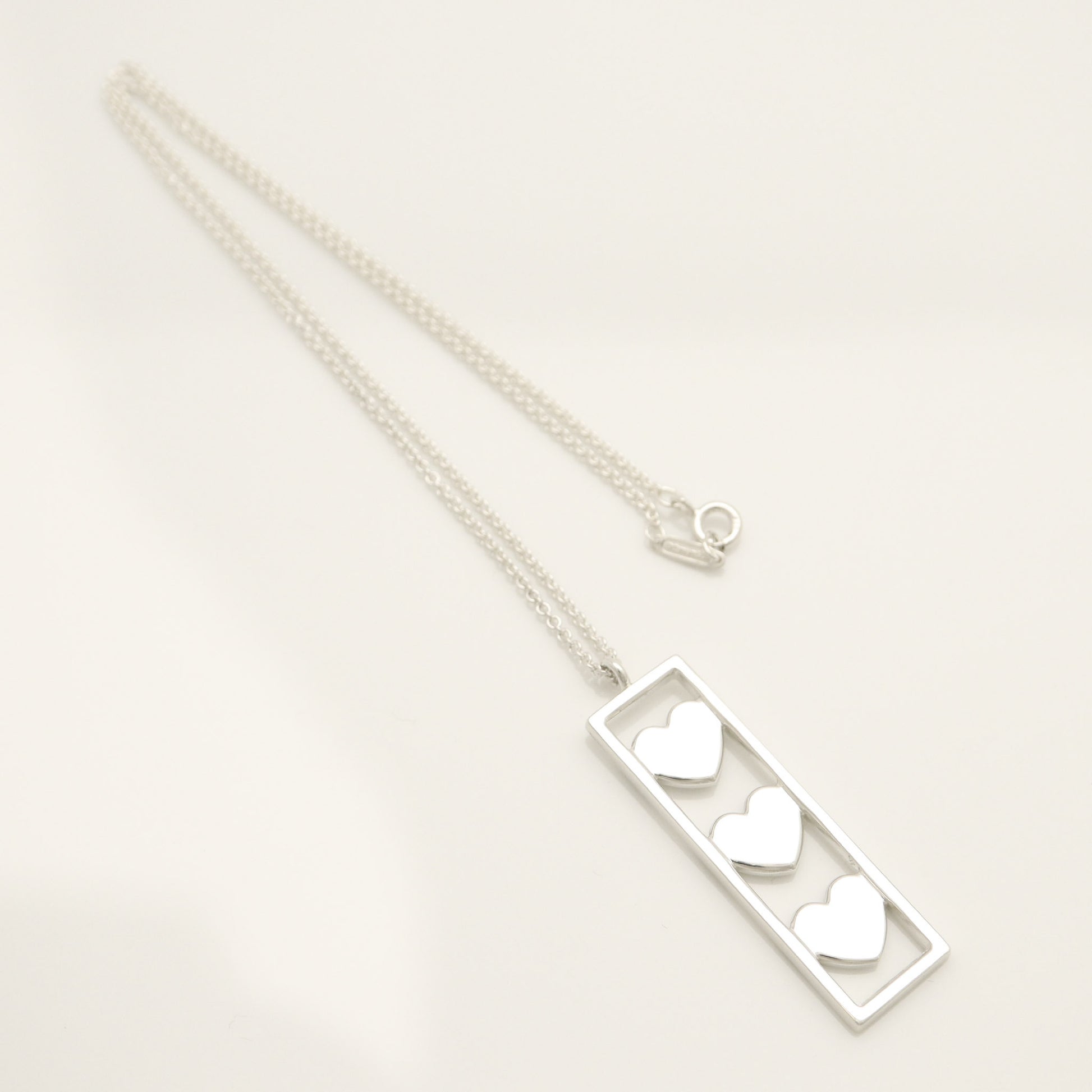 Tiffany & Co. Triple Heart Plate Necklace Pendant in Sterling Silver Weight: 2.58g