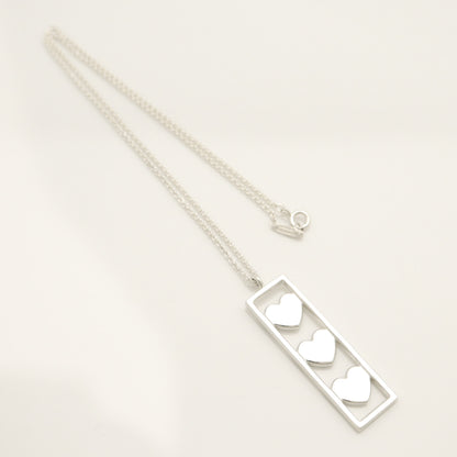 Tiffany & Co. Triple Heart Plate Necklace Pendant in Sterling Silver Weight: 2.58g