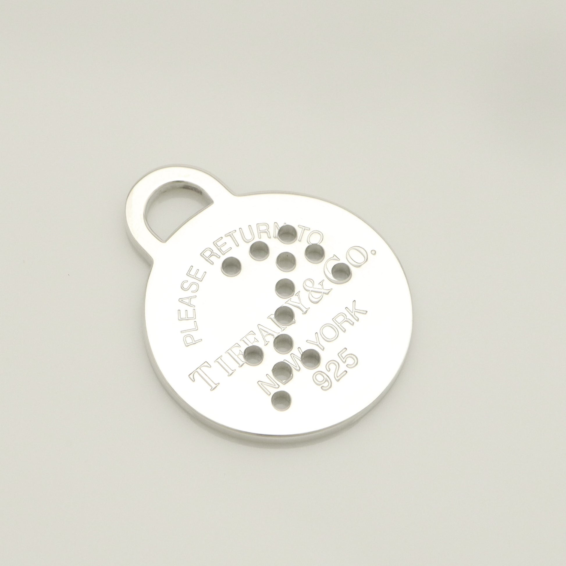 Tiffany & Co. Return to Tiffany Round Tag Arrow Punching Sagittarius Charm, 925 Sterling Silver, 8.20g
