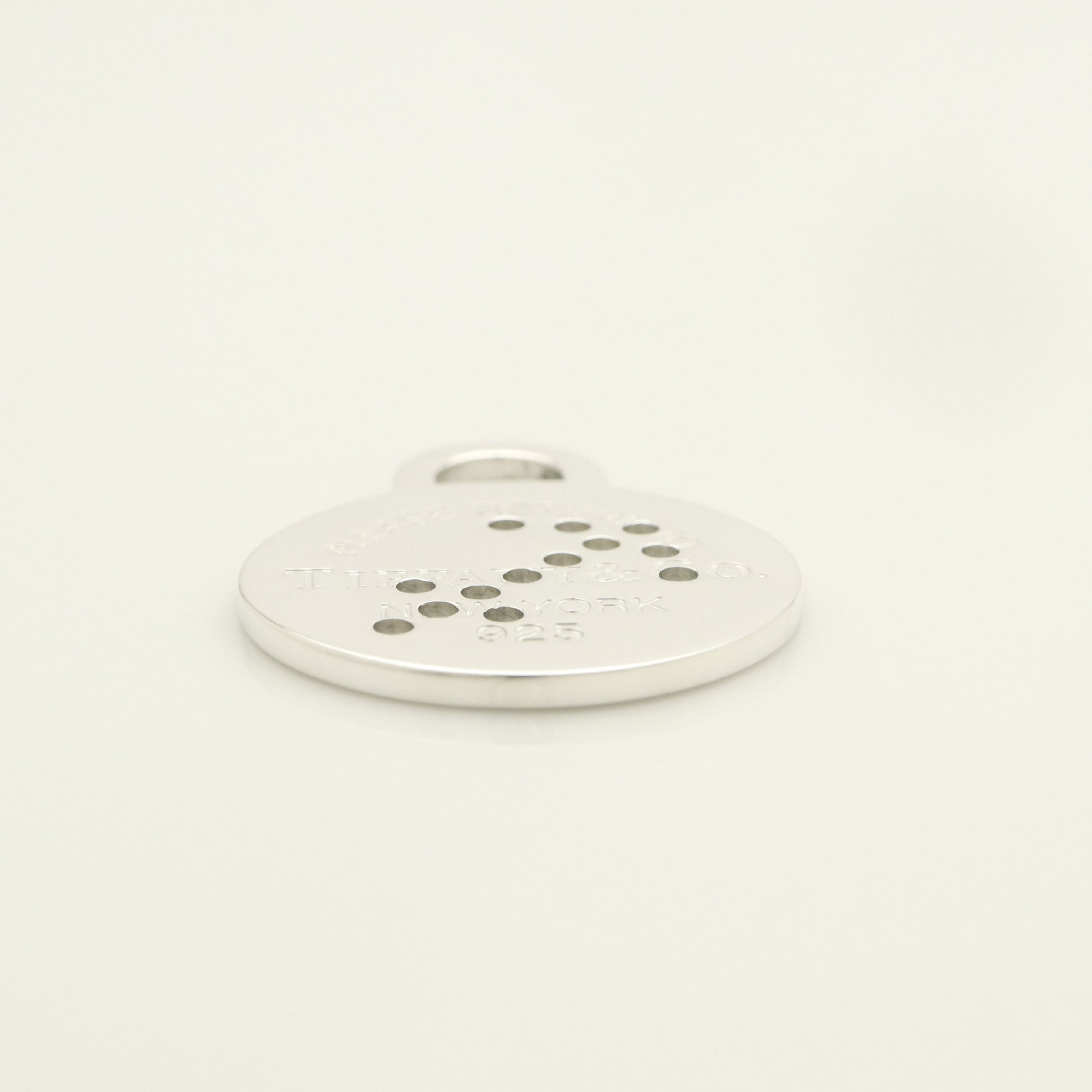 Tiffany & Co. Return to Tiffany Round Tag Arrow Punching Sagittarius Charm, 925 Sterling Silver, 8.20g
