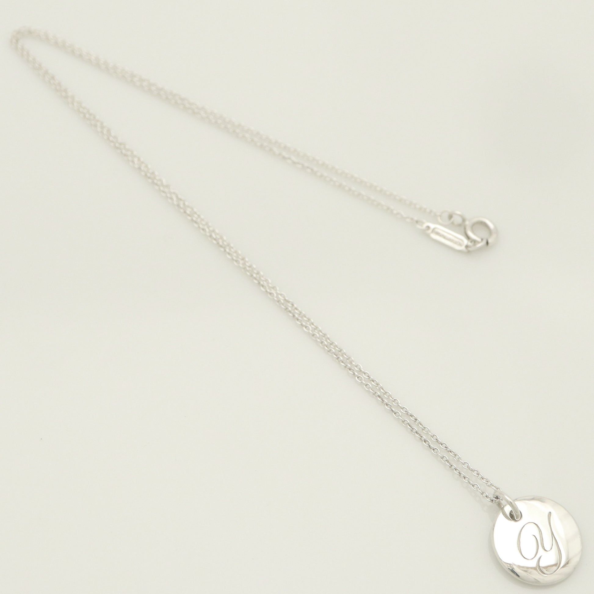 Tiffany & Co. Notes Letter Round Initial Y Disc Necklace in Sterling Silver - Weight: 3.01g