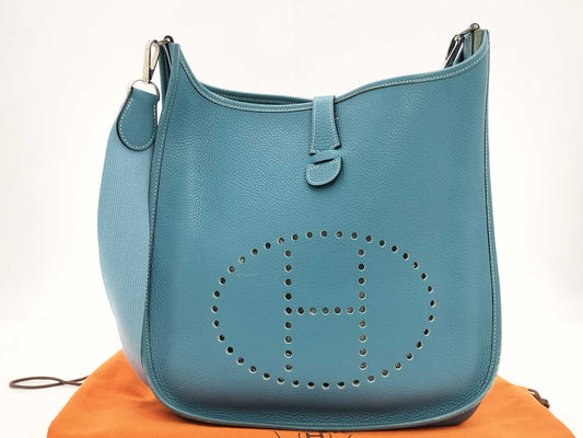 HERMES Evelyn GM Shoulder Bag in Taurillon/Blue Jean with Palladium Hardware and Dust Bag