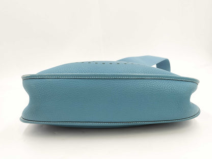 HERMES Evelyn GM Shoulder Bag in Taurillon/Blue Jean with Palladium Hardware and Dust Bag